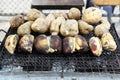 Traditional street food of Thailand - grilled bananas and sweet potato. Royalty Free Stock Photo