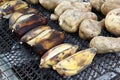 Traditional street food of Thailand - grilled bananas and sweet potato. Royalty Free Stock Photo