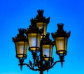 Traditional street lamp post captured in a blue skyline