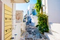 Traditional street of Lefkes village with white houses and green plants Royalty Free Stock Photo