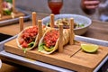 Traditional street mexican pork tacos with beef, tomatoes, avocado, chilli in yellow corn tortilla Royalty Free Stock Photo