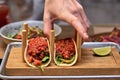 Traditional street mexican pork tacos with beef, tomatoes, avocado, chilli in yellow corn tortilla Royalty Free Stock Photo