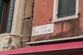 Traditional street name signs in the old town of Venice, Italy