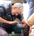 Traditional street shoe cleaner in Porto Portugal