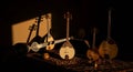 Traditional string instruments basking in golden light Royalty Free Stock Photo