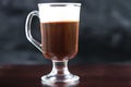 Traditional strong irish coffee on wooden bar