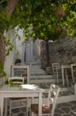 Greek taverna on the narrow streets Royalty Free Stock Photo