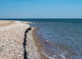 Traditional summer landscape with sandy and pebbly promontory, blue sea and sky, Harilaid Nature Reserve, Estonia, Baltic Sea