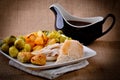 Traditional Sunday dinner with gravy boat. Royalty Free Stock Photo