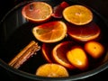 Traditional Swedish Christmas drink, called Glogg, similar to Gluhwein, here being prepared with red wine, oranges and cinnamon Royalty Free Stock Photo