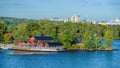 Traditional swedish falun red wooden houses and piers on Fjaderholmarna Feather Islands, nearest archipelago islands from