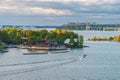 Traditional swedish falun red wooden houses and piers on Fjaderholmarna Feather Islands, nearest archipelago islands from