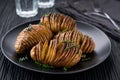 Traditional Swedish recipe delicious baked potatoes with herbs and oil, Hasselback potato Royalty Free Stock Photo