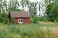 Traditional Swedish red house in summer landscape Royalty Free Stock Photo