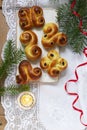 Traditional Swedish saffron buns of various shapes on a light background.