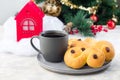 Traditional Swedish and scandinavian Christmas saffron buns Lussekatter with cup of coffee, Christmas decoration on background,