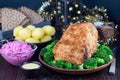 Traditional swedish and scandinavian Christmas table with baked ham in mustard crumble crust, beet salad and whole grane crackers