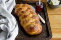 Traditional sweet Easter bread with raisins, dried cherries on an old baking tray jam and butter. Cozonac - Bulgarian Easter bread Royalty Free Stock Photo