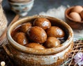 Traditional Sweet Glazed Gulab Jamun in Earthen Bowl on Rustic Kitchen Table with Ingredients