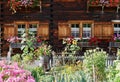 Traditional Swiss country house with cottage garden. St. Antoenien, Grisons, Switzerland. Royalty Free Stock Photo