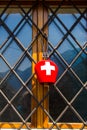 Traditional swiss cow bell with national flag design of red-white cross Royalty Free Stock Photo