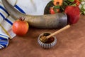The traditional symbols of the Jewish New Year holiday of Rosh Hashanah include apples, honey, pomegranates, and shofars