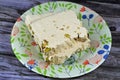 Traditional tahini halva with pistachios or Halawa Tahiniya, the primary ingredients in this confection are sesame butter or paste
