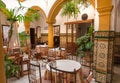 Traditional tapas bar or restaurant with wintage decoration and andalusian tiles on walls