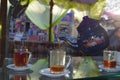 Traditional tea poured from a teapot cups in Arabic Cafe