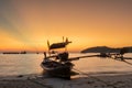 Traditional thai boats at sunset beach in Phuket Royalty Free Stock Photo