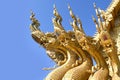 Traditional thai dragon statue against blue sky Royalty Free Stock Photo