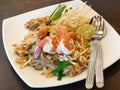 Traditional Thai famous street food, stir fried noodle with sprouts topped with shrimp, call 