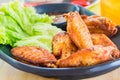 Traditional Thai fired chicken wing close up