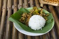 Traditional thai food cuisine spicy stir-fried wild boar and yellow spice curry meat pork vegetable topping on cooked rice on Royalty Free Stock Photo