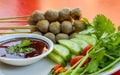 Traditional Thai food, grilled pork meatballs and fresh vegetables with sweet chili sauce. Royalty Free Stock Photo