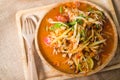 Traditional Thai food papaya salad prepared with fine slices of papaya, tomatoes, green beans and peanuts Royalty Free Stock Photo