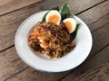 Spicy winged bean and shrimp salad with boiled egg and Piper betel leave on white iron plate, Thai food