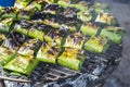 Traditional Thai food style, Grill marinate fish with herbs wrap with banana leaves Royalty Free Stock Photo