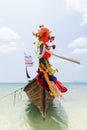 Traditional Thai long tail wooden boat with decoration moored at Railay beach in Krabi province, Thailand Royalty Free Stock Photo