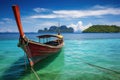 Traditional Thai longtail boat in Andaman sea, Krabi, Thailand, Longtail boat anchored in the sea, with the landscape of the
