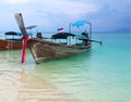 Thai longtail boat on crystal clear green turquoise water of famous tropical white sand beach at Krabi, Andaman Sea, Thailand Royalty Free Stock Photo