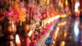 Traditional Thai offering with incense and candles. Detailed view of a merit-making altar in a temple. Concept of