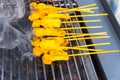 Traditional Thai pork of chicken grilling on the stove grill (Thai name is Pork Satay)