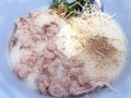 Traditional thai porridge rice gruel in white bowl, congee. In the street night market. Royalty Free Stock Photo
