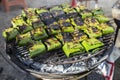 Traditional Thai style food wrap in a banana leaf on the grill Royalty Free Stock Photo