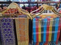 Traditional Thai-Style Patterned Clothes Hanging on Rack