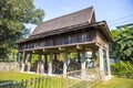 Traditional Thai style rice barn with wooden cart under the barn Royalty Free Stock Photo