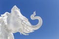 Traditional Thai style white elephant sculpture with space on clear blue sky background Royalty Free Stock Photo