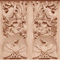 Traditional Thai style wood carving on the wall of Temple in Thailand