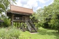 Traditional Thai style wooden house surrounded with nature Royalty Free Stock Photo